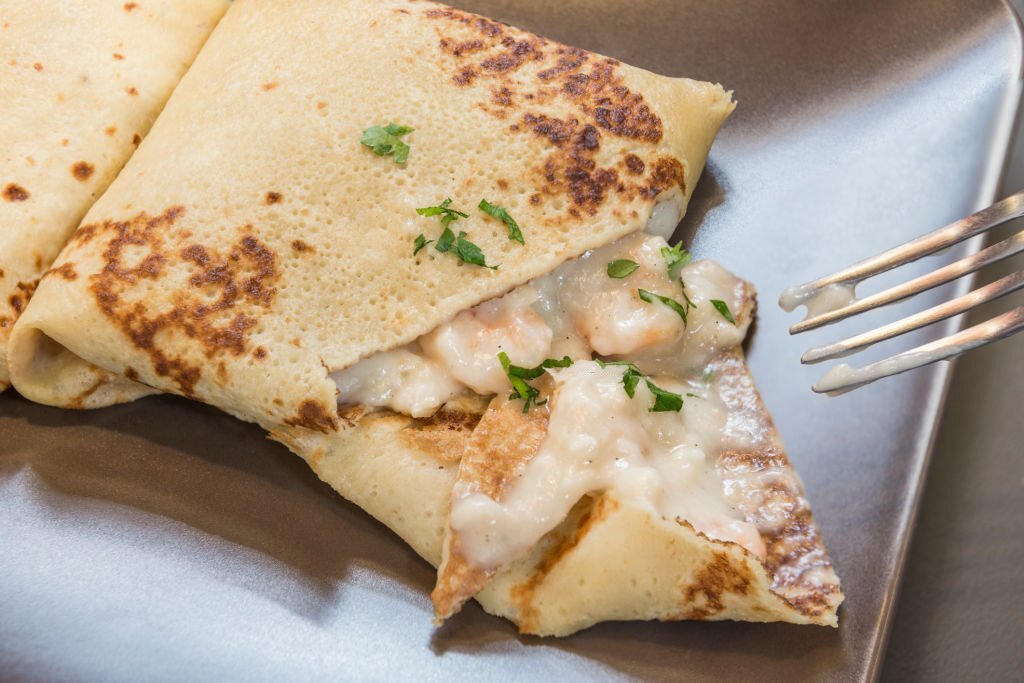 Crepe with shrimps in a restaurant.
